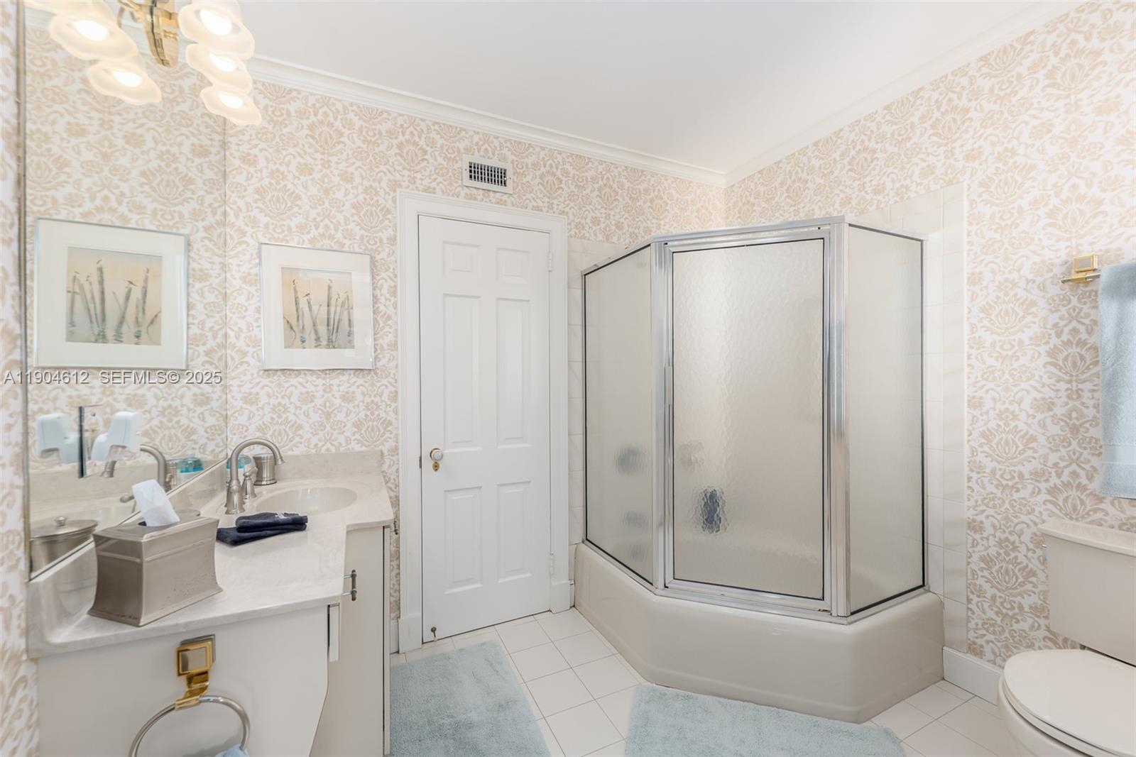 247 South Beach Road Jupiter Island, FL 33455 - Photo 46 of 71 a bathroom with a shower a toilet and sink