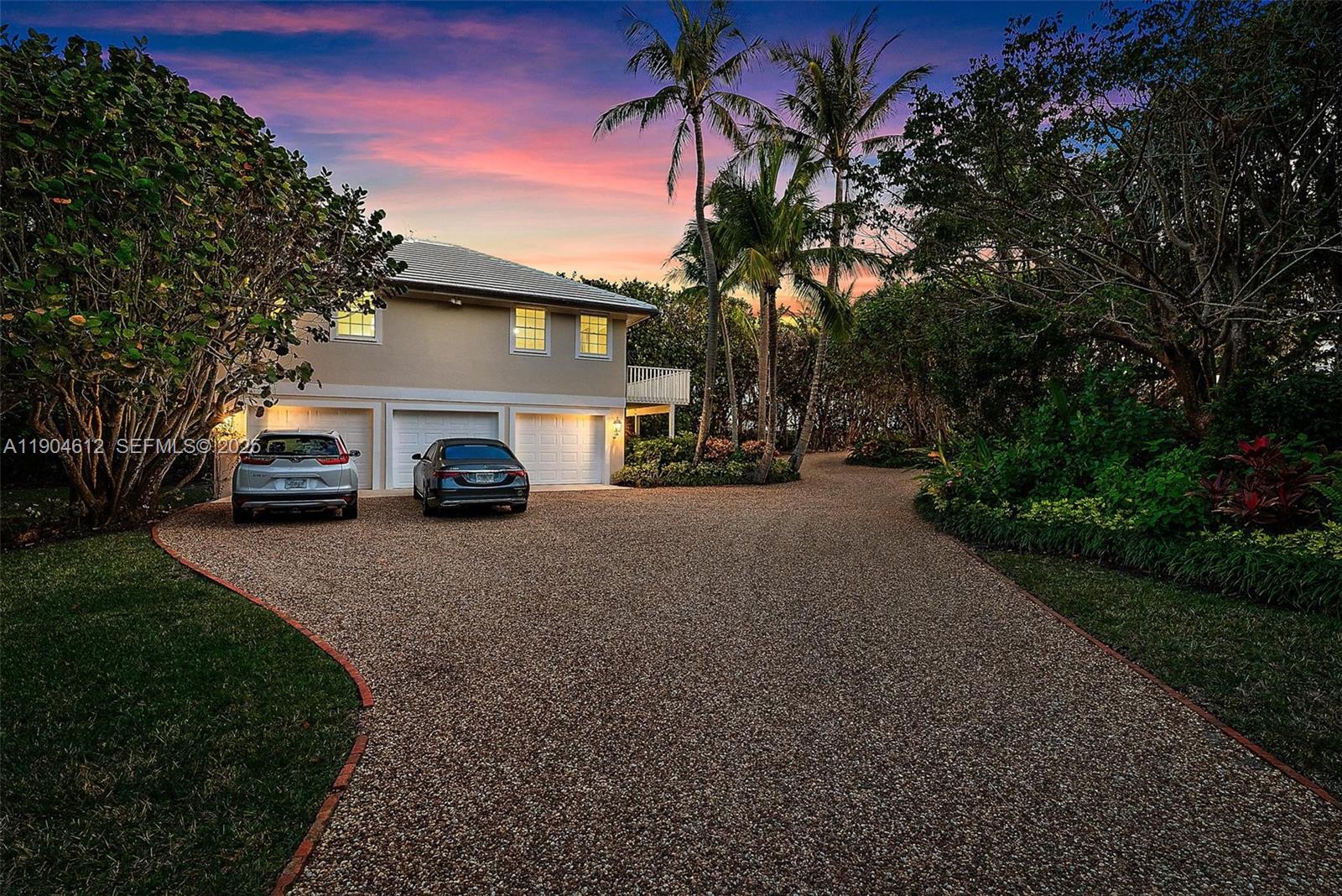 247 South Beach Road Jupiter Island, FL 33455 - Photo 48 of 71 a view of a car park in front of the house