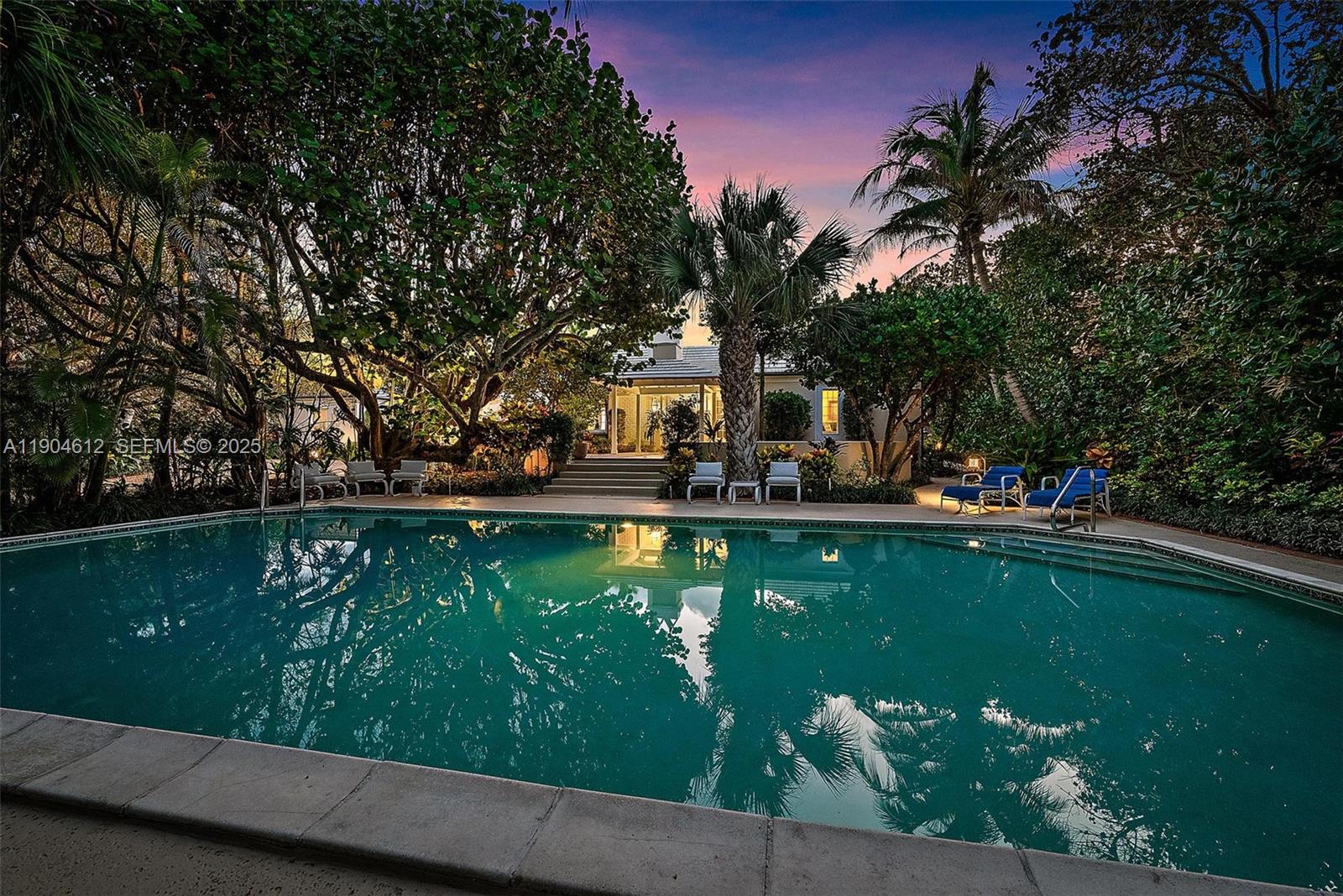 247 South Beach Road Jupiter Island, FL 33455 - Photo 52 of 71 a view of a swimming pool with a garden