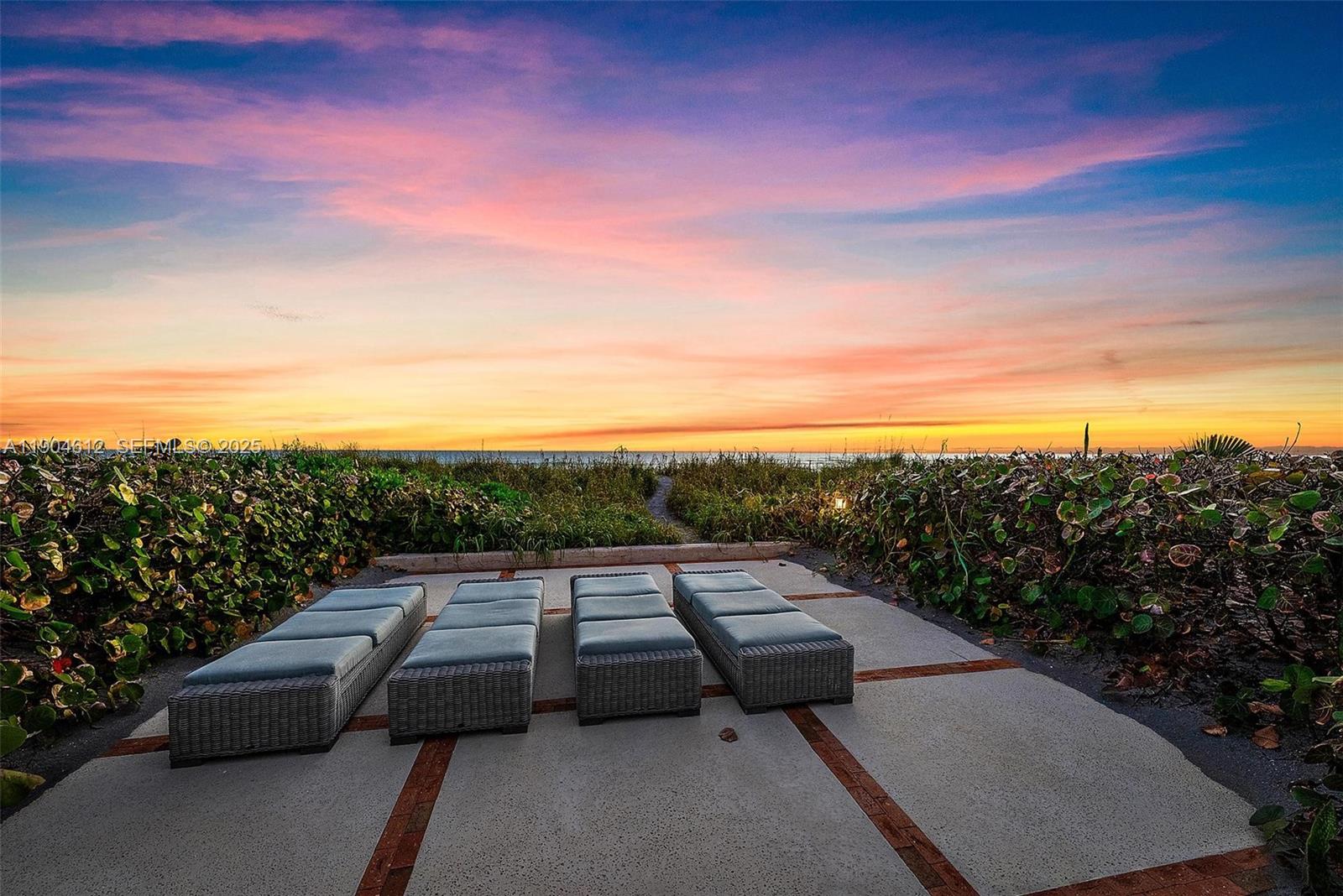 247 South Beach Road Jupiter Island, FL 33455 - Photo 55 of 71 a view of terrace with lawn chairs and mountain view