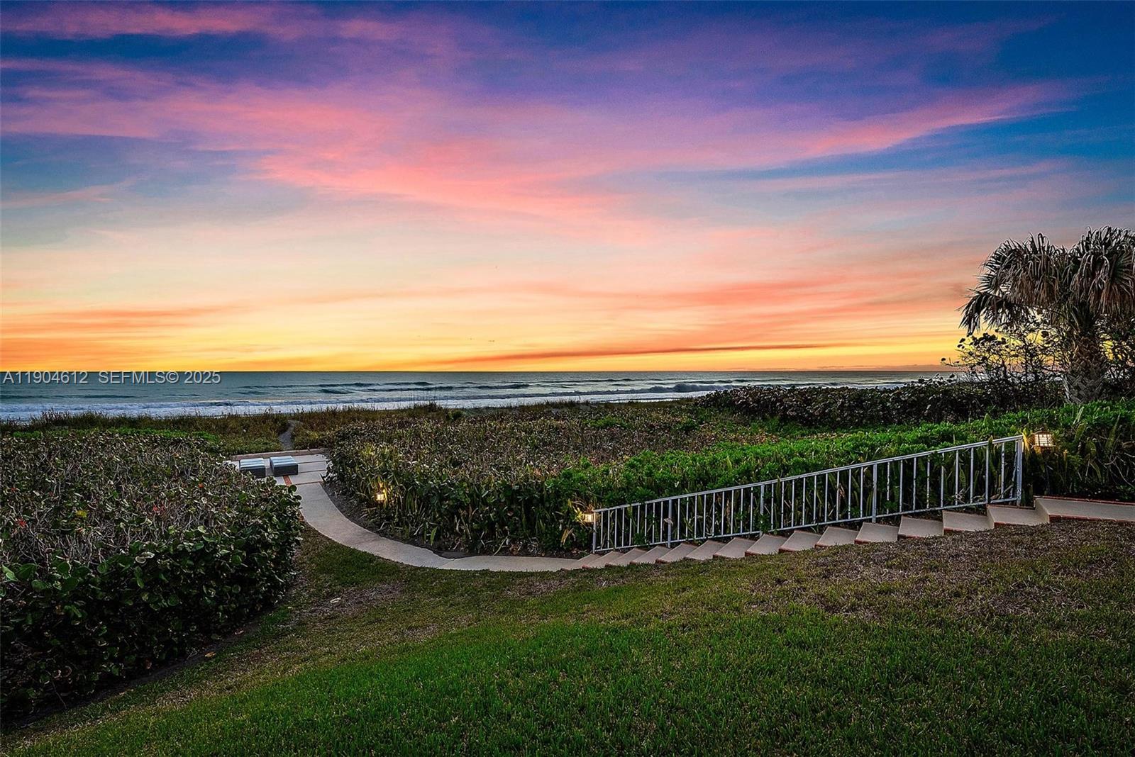 247 South Beach Road Jupiter Island, FL 33455 - Photo 60 of 71 a view of a garden with mountain in the background