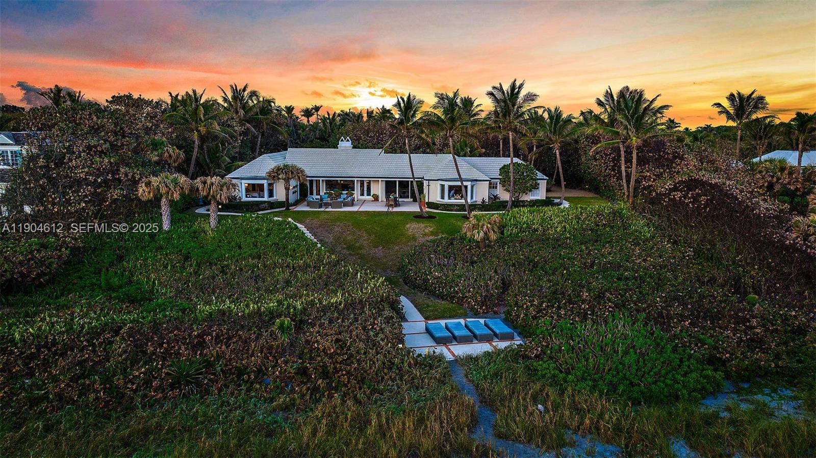 247 South Beach Road Jupiter Island, FL 33455 - Photo 70 of 71 a aerial view of a house with a yard and sitting area