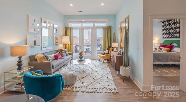 a living room with furniture and a large window