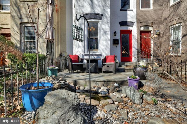 a view of water fountain in front of building
