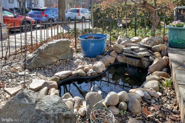 a view of a backyard with sitting area