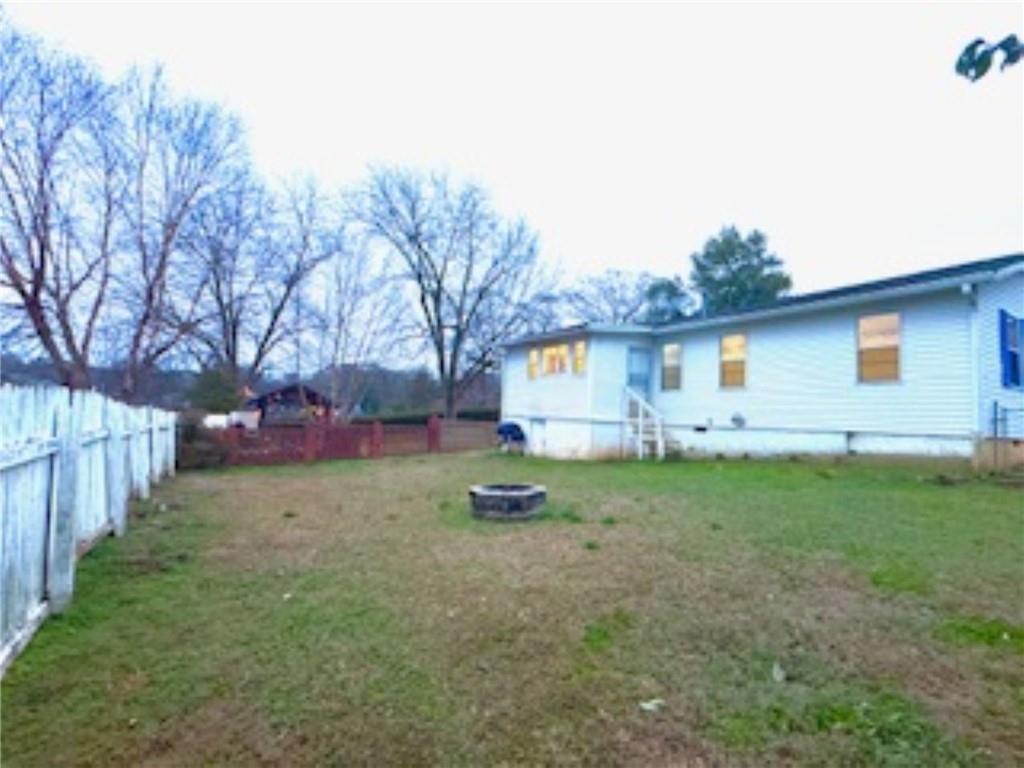 209 Moultrie Lane Southwest Rome, GA 30161 - Photo 11 of 49 a backyard of a house with lots of green space