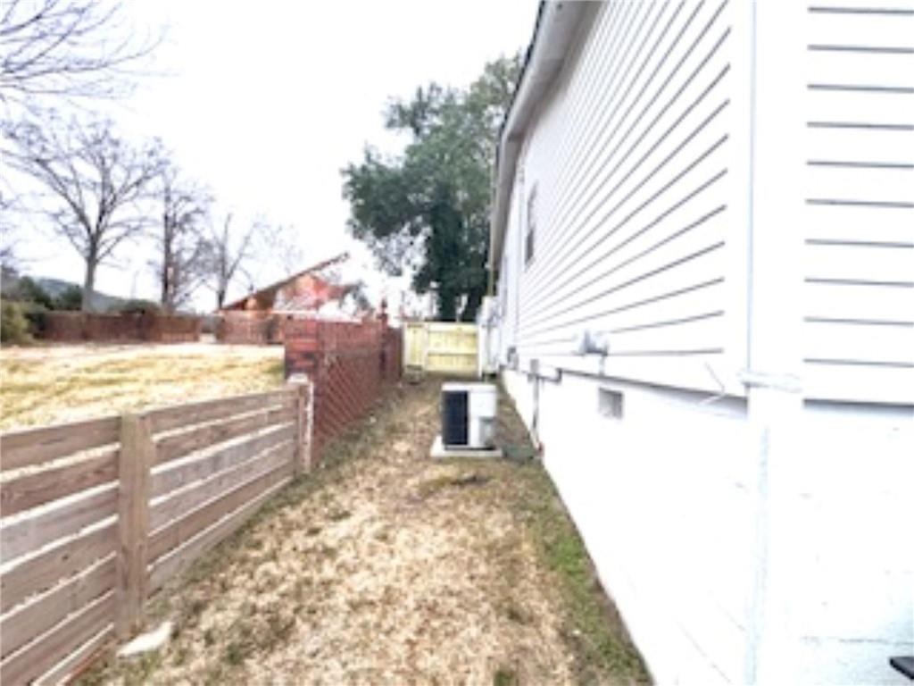 209 Moultrie Lane Southwest Rome, GA 30161 - Photo 13 of 49 a view of a terrace with wooden floor and a yard
