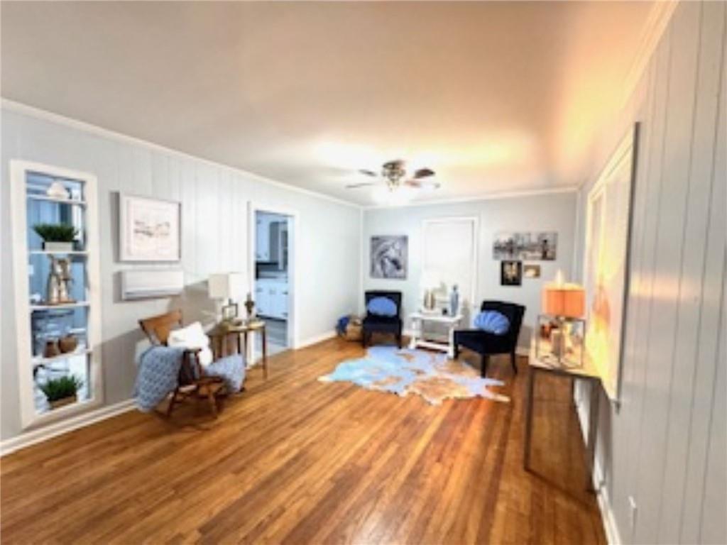 209 Moultrie Lane Southwest Rome, GA 30161 - Photo 15 of 49 a living room with furniture and a wooden floor
