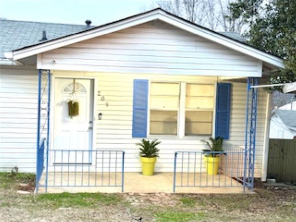 209 Moultrie Lane Southwest Rome, GA 30161 - Photo 2 of 49 a front view of a house with a yard