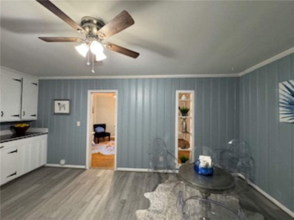 209 Moultrie Lane Southwest Rome, GA 30161 - Photo 24 of 49 a view of an empty room with window and wooden floor