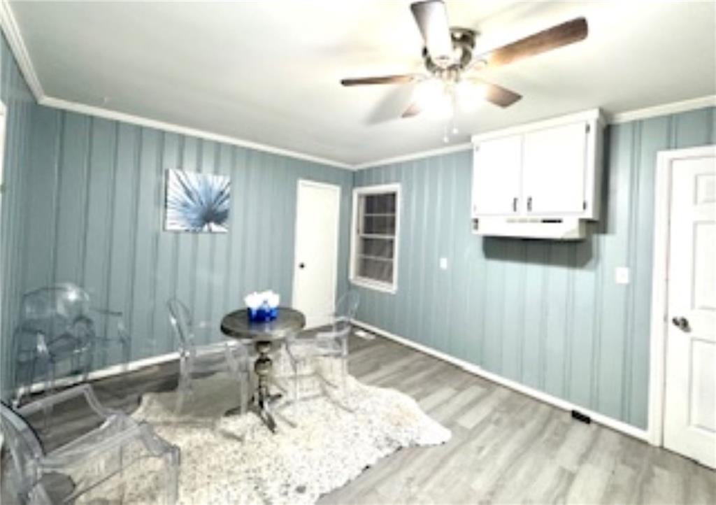 209 Moultrie Lane Southwest Rome, GA 30161 - Photo 28 of 49 a dining room with wooden floor and a chandelier fan