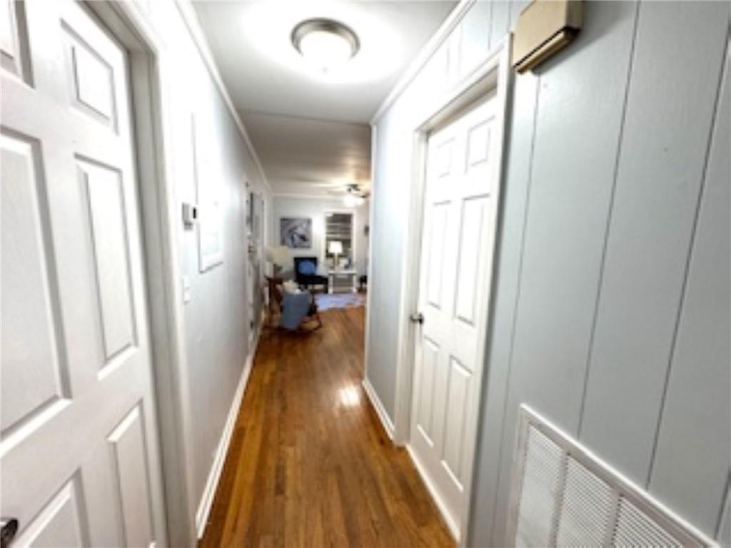 209 Moultrie Lane Southwest Rome, GA 30161 - Photo 33 of 49 a view of a hallway with wooden floor and staircase