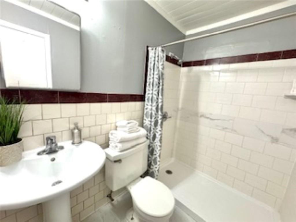 209 Moultrie Lane Southwest Rome, GA 30161 - Photo 37 of 49 a bathroom with a sink toilet and shower