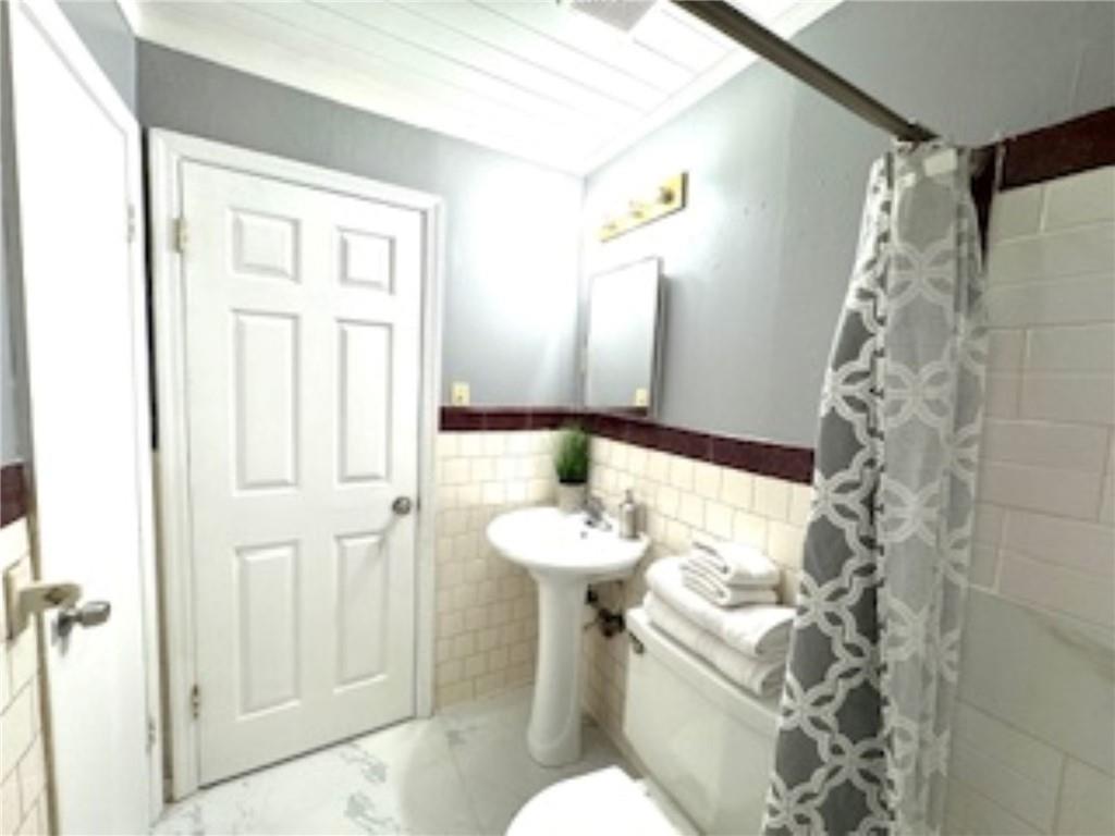 209 Moultrie Lane Southwest Rome, GA 30161 - Photo 38 of 49 a bathroom with a sink toilet and shower