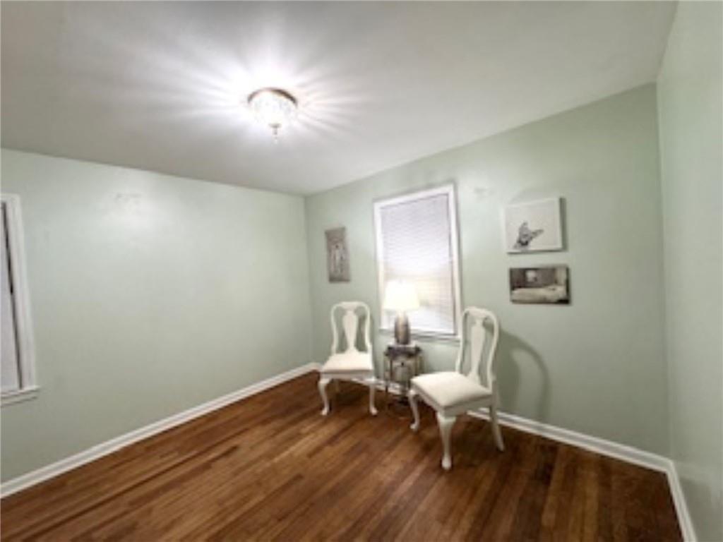 209 Moultrie Lane Southwest Rome, GA 30161 - Photo 40 of 49 a living room with furniture and a wooden floor