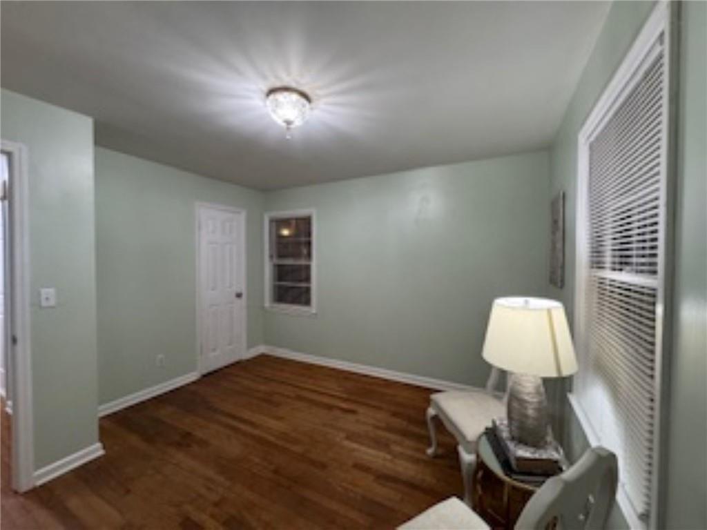 209 Moultrie Lane Southwest Rome, GA 30161 - Photo 41 of 49 a bed room with a bed and a lamp