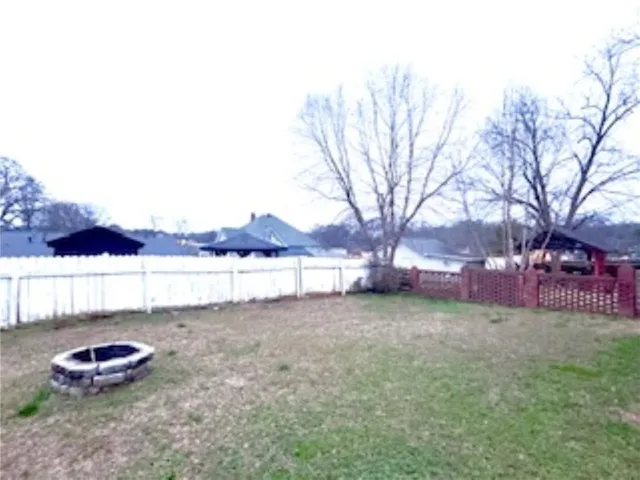 a kitchen with stainless steel appliances kitchen island granite countertop a sink and a refrigerator