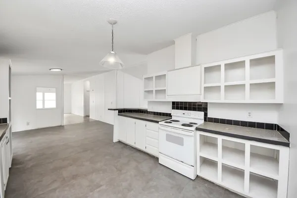 a kitchen with a sink and cabinets