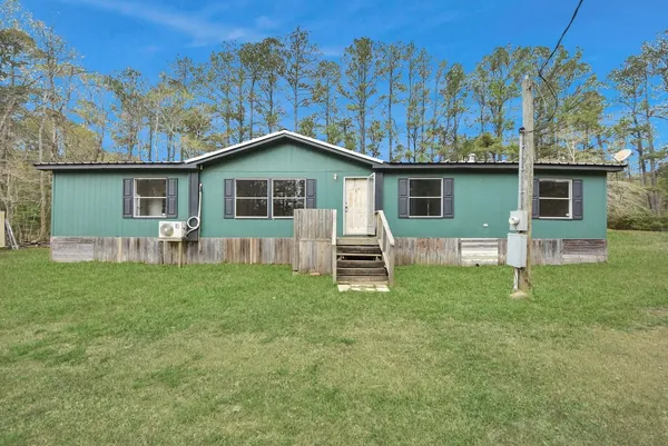 a house view with a garden space