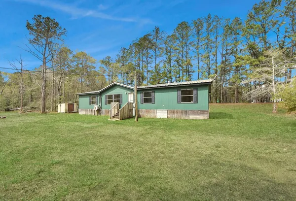 a view of a room with wooden floor and staircase