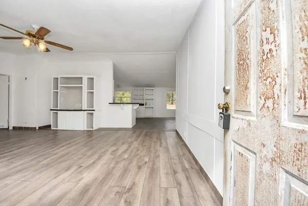 a view of an empty room with a window