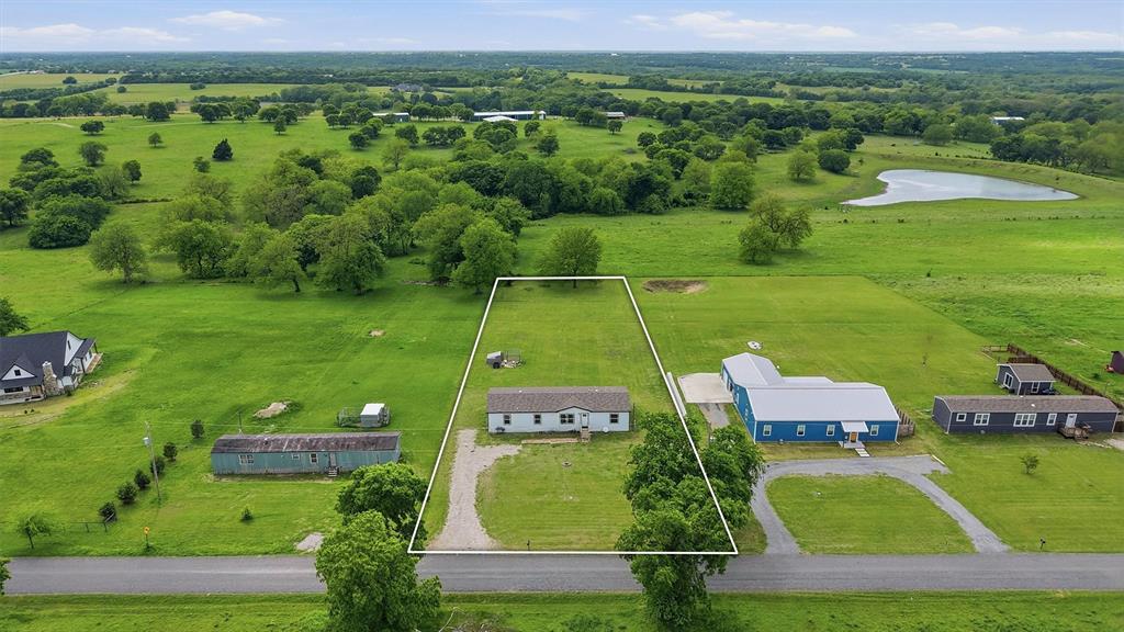 587 Kentucky Town Road Whitewright, TX 75491 - Photo 31 of 39 an aerial view of a pool