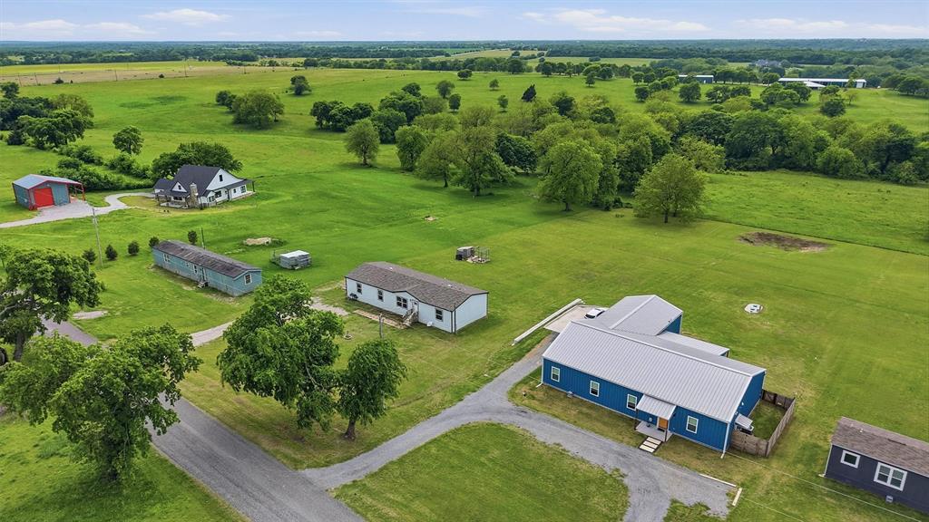 587 Kentucky Town Road Whitewright, TX 75491 - Photo 34 of 39 an aerial view of a house with garden