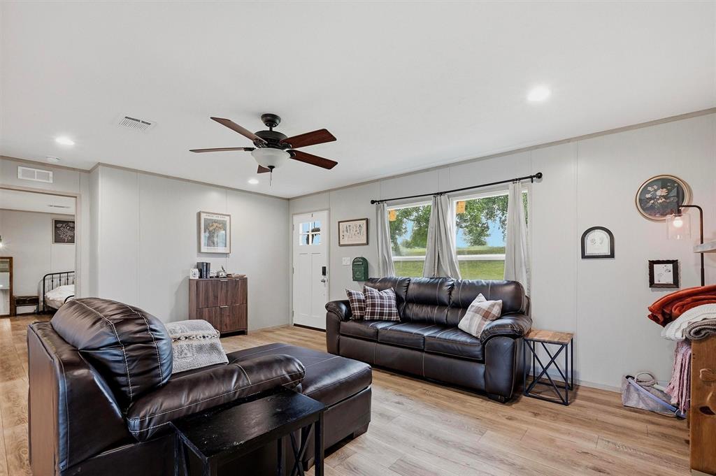 587 Kentucky Town Road Whitewright, TX 75491 - Photo 6 of 39 a living room with furniture and a large window