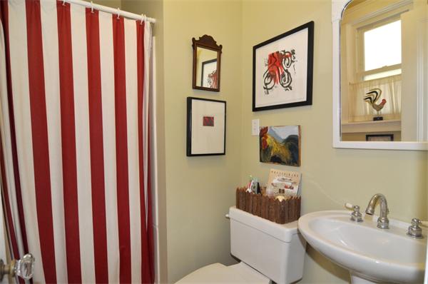 5 Highland Road Tiverton, RI 02878 - Photo 12 of 26 a bathroom with a toilet a sink and mirror