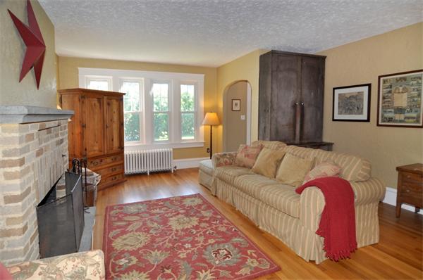 5 Highland Road Tiverton, RI 02878 - Photo 8 of 26 a living room with furniture and a fireplace