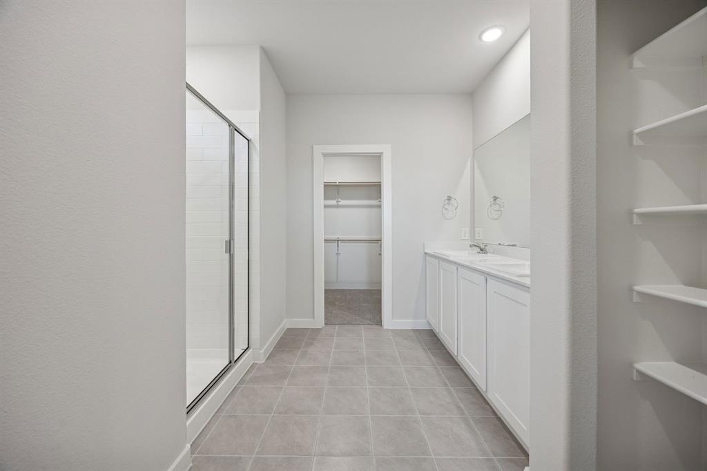316 Millwood Road Lavon, TX 75166 - Photo 19 of 37 Primary Bathroom in the Oak II home plan by Trophy Signature Homes – REPRESENTATIVE PHOTO