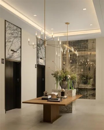 a kitchen with a chandelier furniture and window
