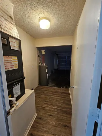 a room with a bed and a television