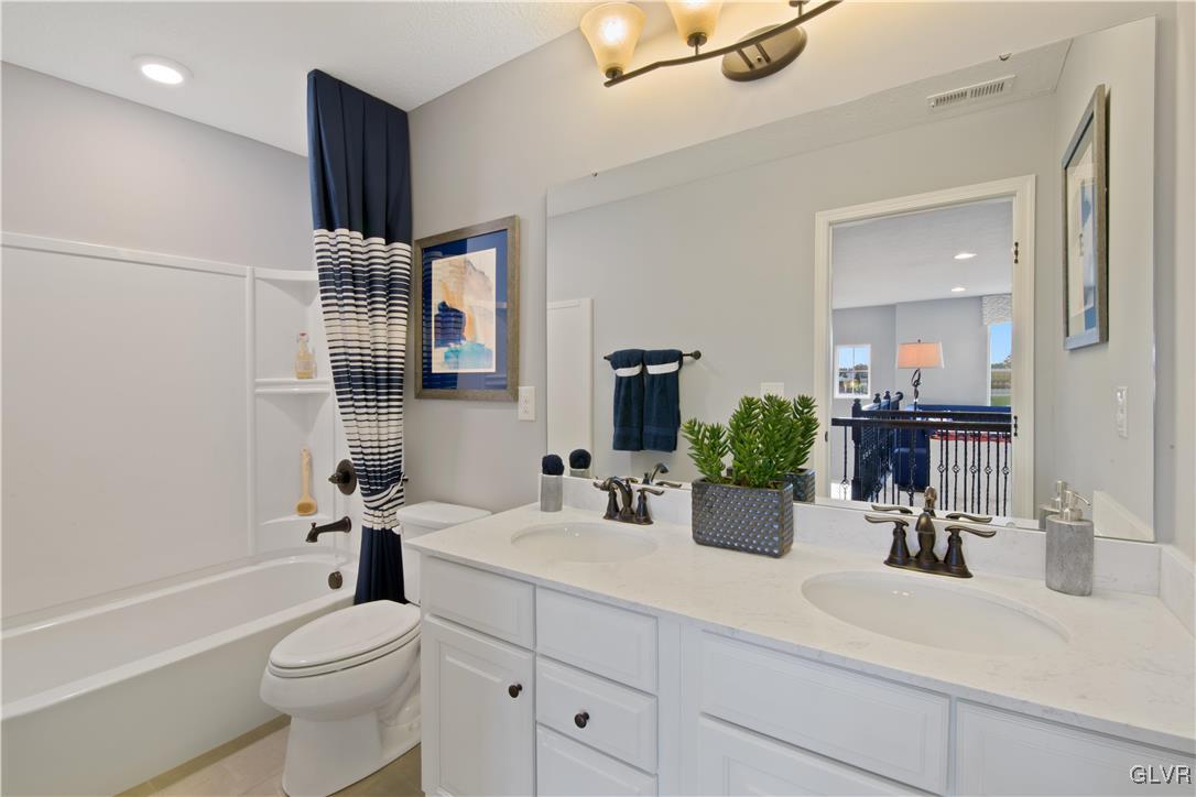 2875 10th Street Bethlehem, PA 18020 - Photo 13 of 15 a bathroom with a sink a toilet and shower