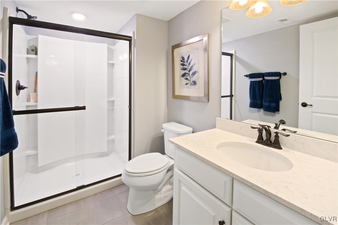 2875 10th Street Bethlehem, PA 18020 - Photo 15 of 15 a bathroom with a sink a toilet and shower
