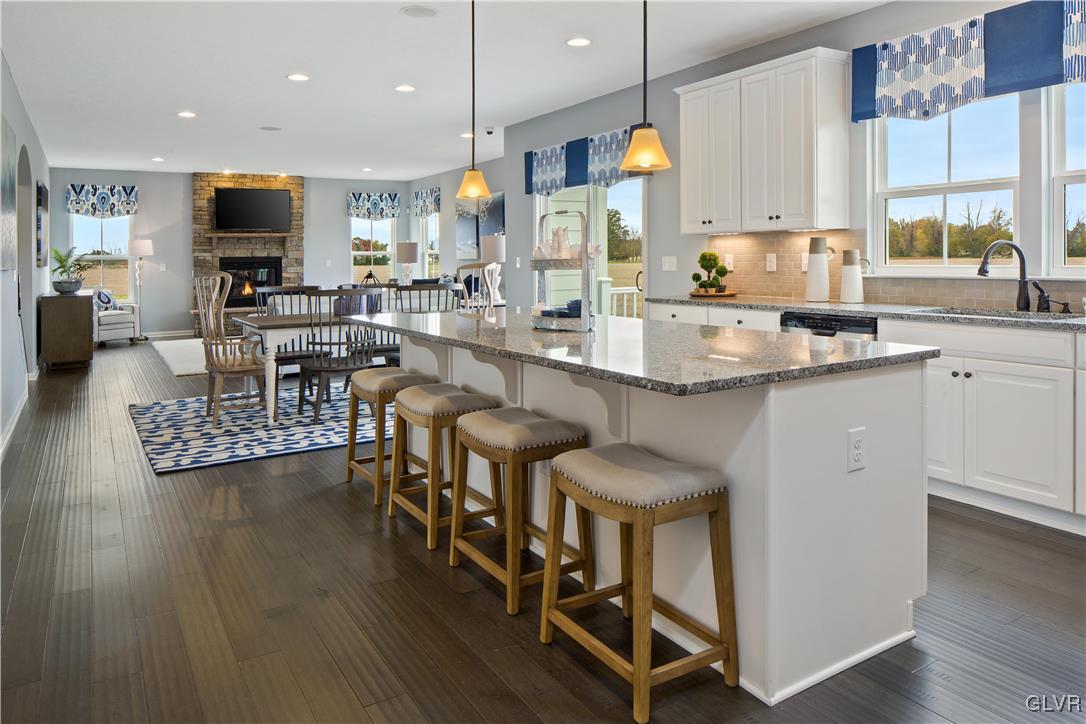 2875 10th Street Bethlehem, PA 18020 - Photo 2 of 15 a kitchen with stainless steel appliances granite countertop table chairs sink and cabinets
