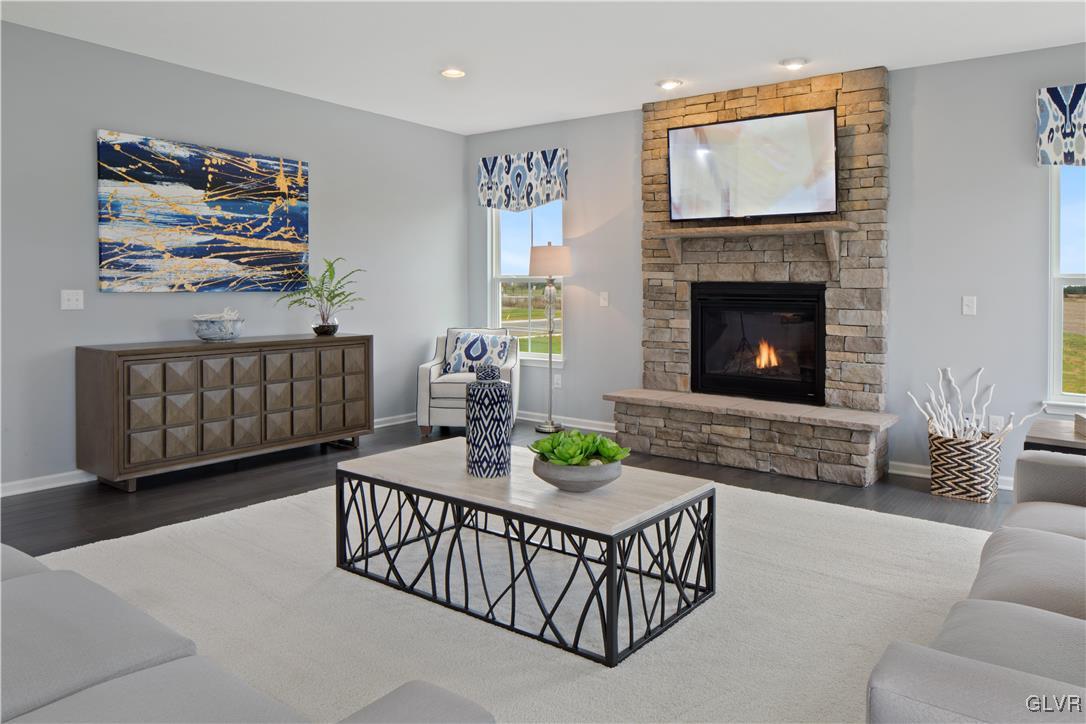 2875 10th Street Bethlehem, PA 18020 - Photo 4 of 15 a living room with furniture a flat screen tv and a fireplace