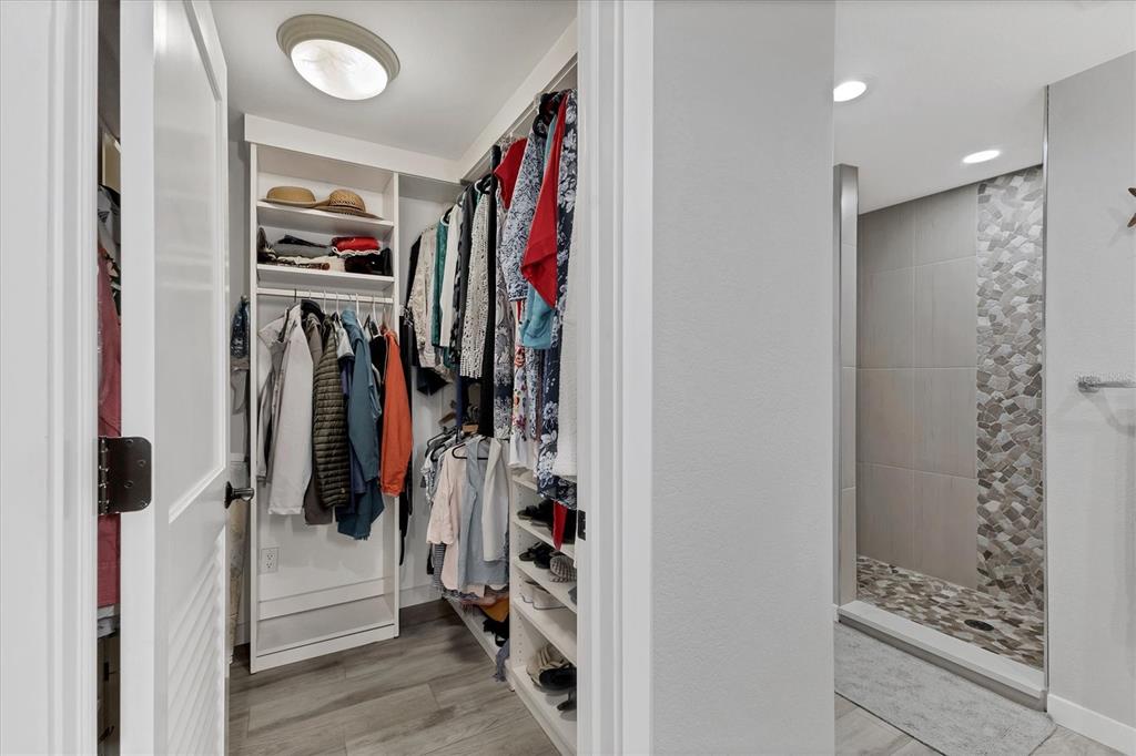 11000 Placida Road, Unit 302 Placida, FL 33946 - Photo 21 of 48 a view of walk in closet with clothes and shoes