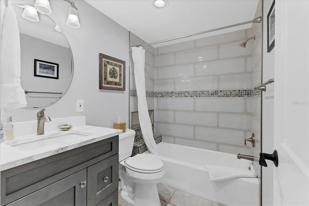 11000 Placida Road, Unit 302 Placida, FL 33946 - Photo 27 of 48 a bathroom with a sink a toilet and shower