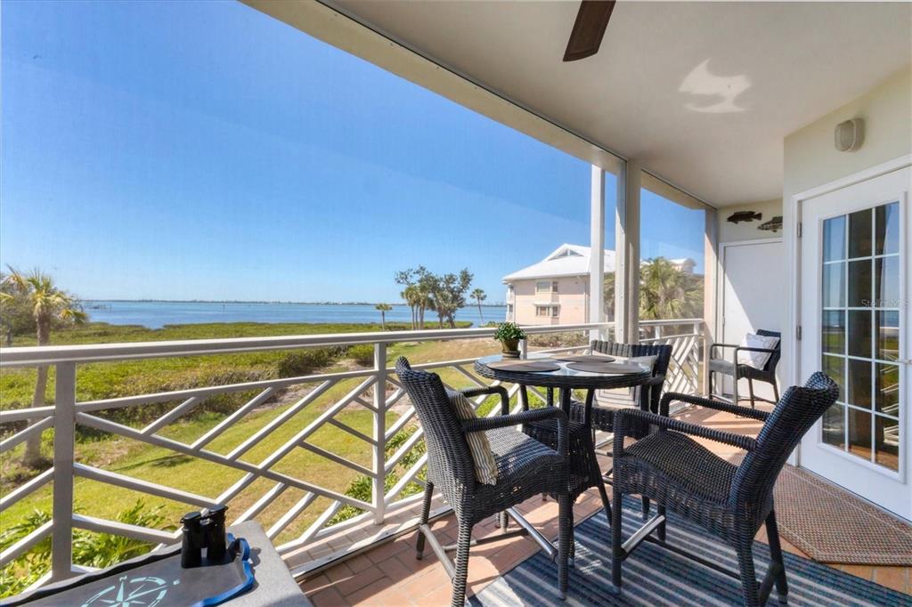 11000 Placida Road, Unit 302 Placida, FL 33946 - Photo 28 of 48 a view of a dining room with furniture and window