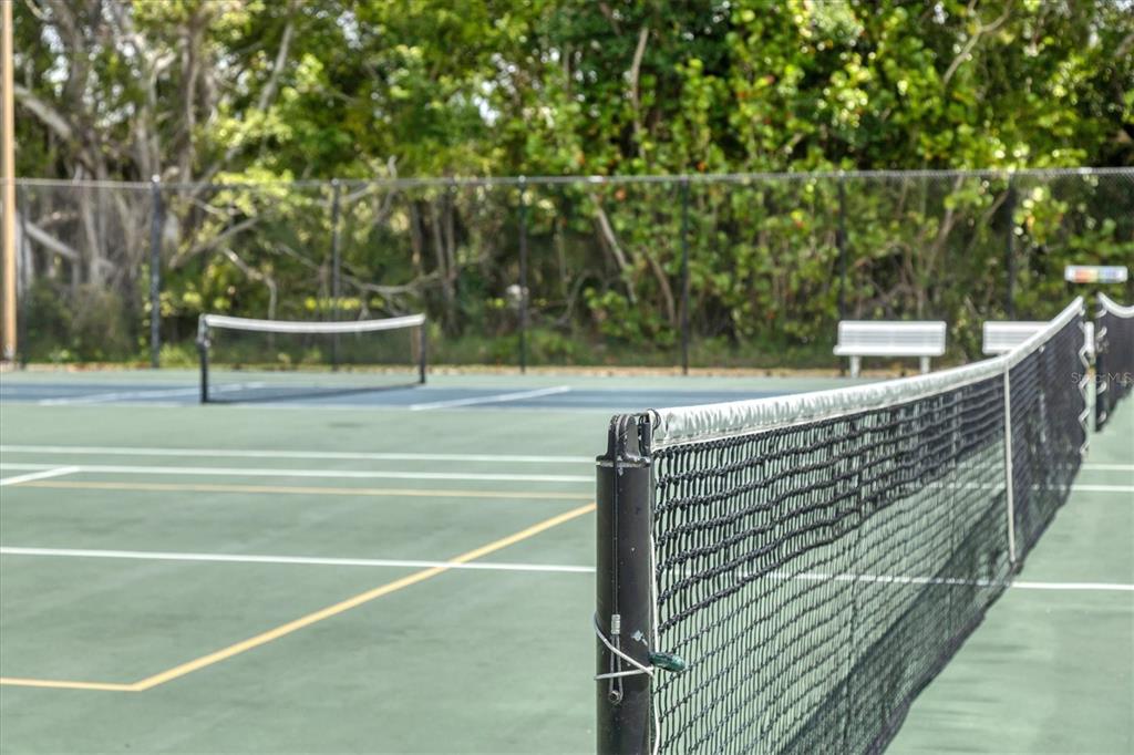 11000 Placida Road, Unit 302 Placida, FL 33946 - Photo 43 of 48 a view of outdoor space and tennis court