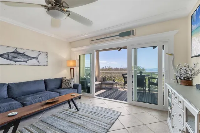 a kitchen with stainless steel appliances kitchen island granite countertop a refrigerator and cabinets
