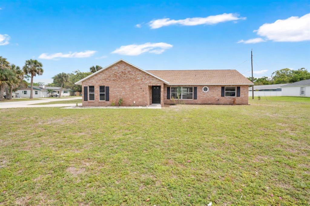 1842 Umbrella Tree Drive Edgewater, FL 32141 - Photo 1 of 32 a view of a house with a ocean view