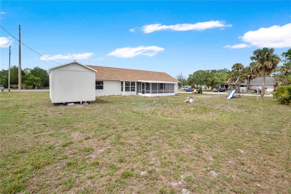 1842 Umbrella Tree Drive Edgewater, FL 32141 - Photo 25 of 32 a house view with a garden space