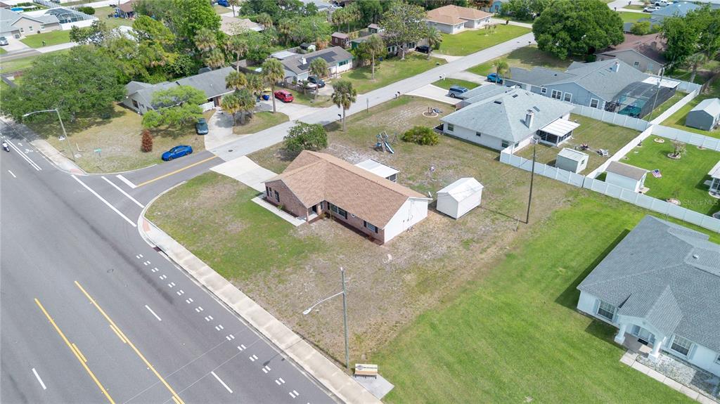 1842 Umbrella Tree Drive Edgewater, FL 32141 - Photo 28 of 32 an aerial view of residential houses with outdoor space