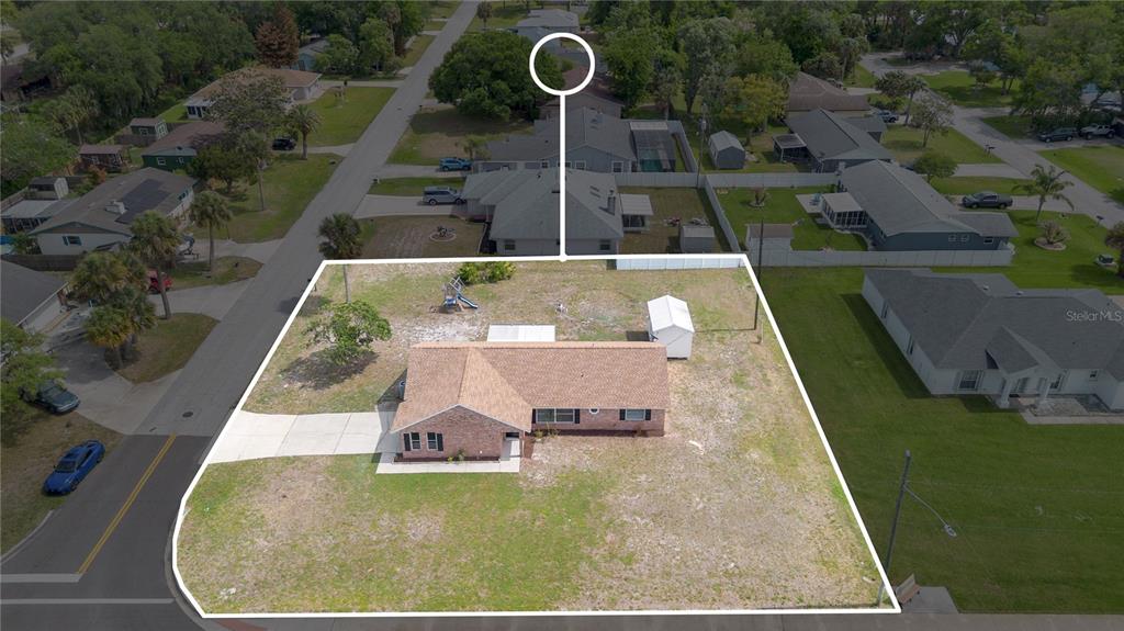 1842 Umbrella Tree Drive Edgewater, FL 32141 - Photo 32 of 32 an aerial view of a house with swimming pool