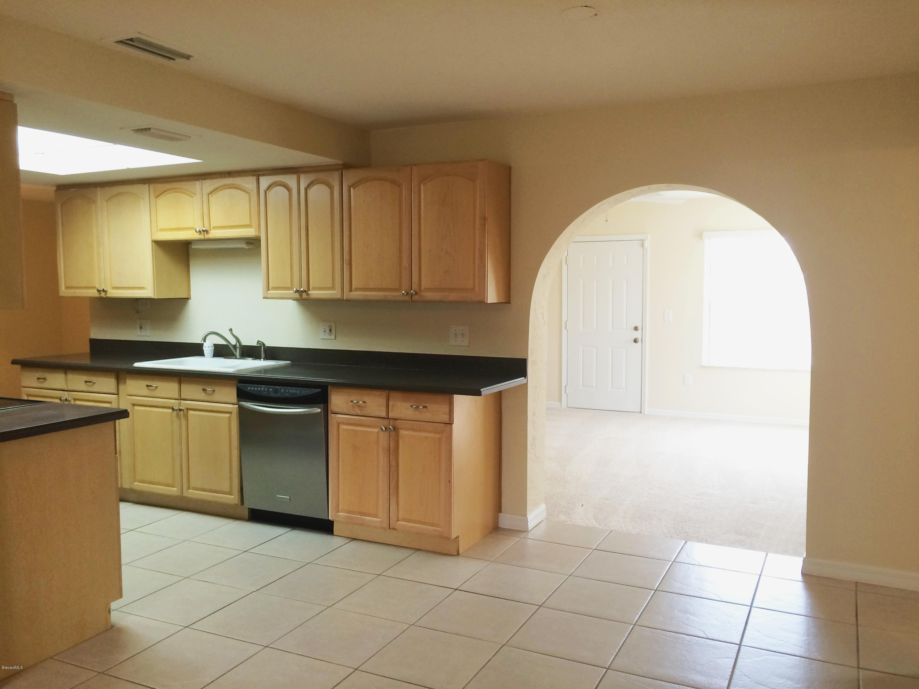 567 Croton Road Melbourne, FL 32935 - Photo 4 of 11 Kitchen and Formal Living Room