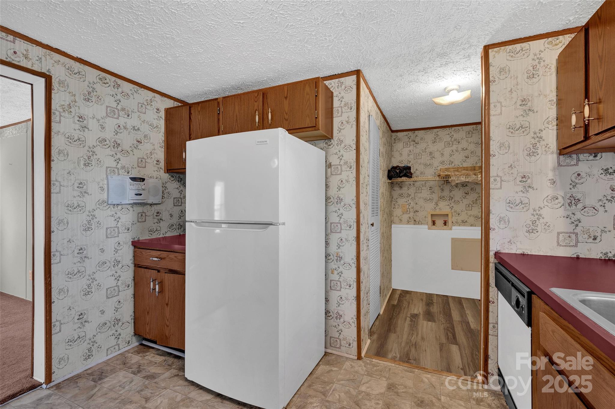 4586 Deal Road Claremont, NC 28610 - Photo 11 of 24 a white refrigerator freezer and a stove sitting inside of a kitchen