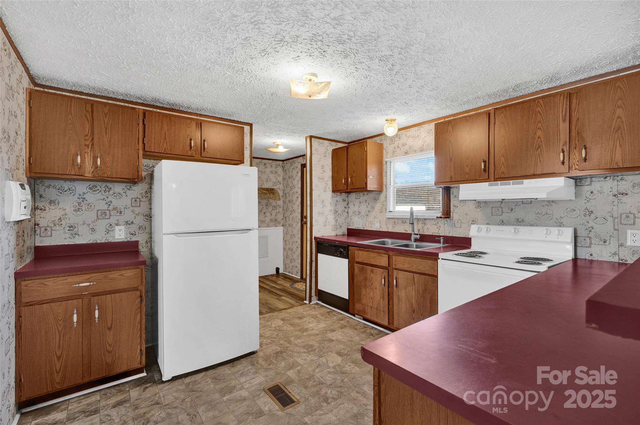 4586 Deal Road Claremont, NC 28610 - Photo 13 of 24 a kitchen with a sink appliances and cabinets