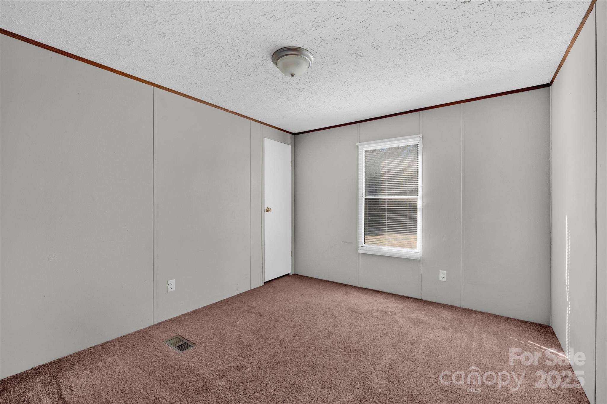 4586 Deal Road Claremont, NC 28610 - Photo 16 of 24 a view of an empty room with a window